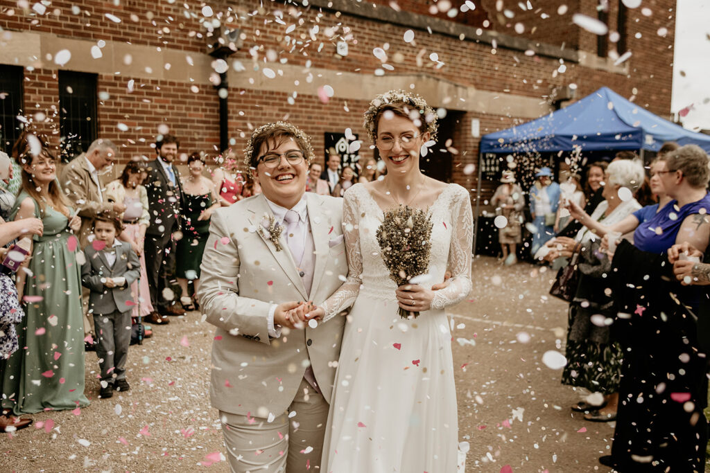 Biodegradable confetti for this wedding looked beautiful as they walked out of their wedding venue