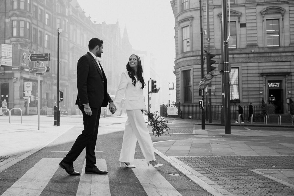 Bride and groom walking hand in hand who decided to elope in the UK