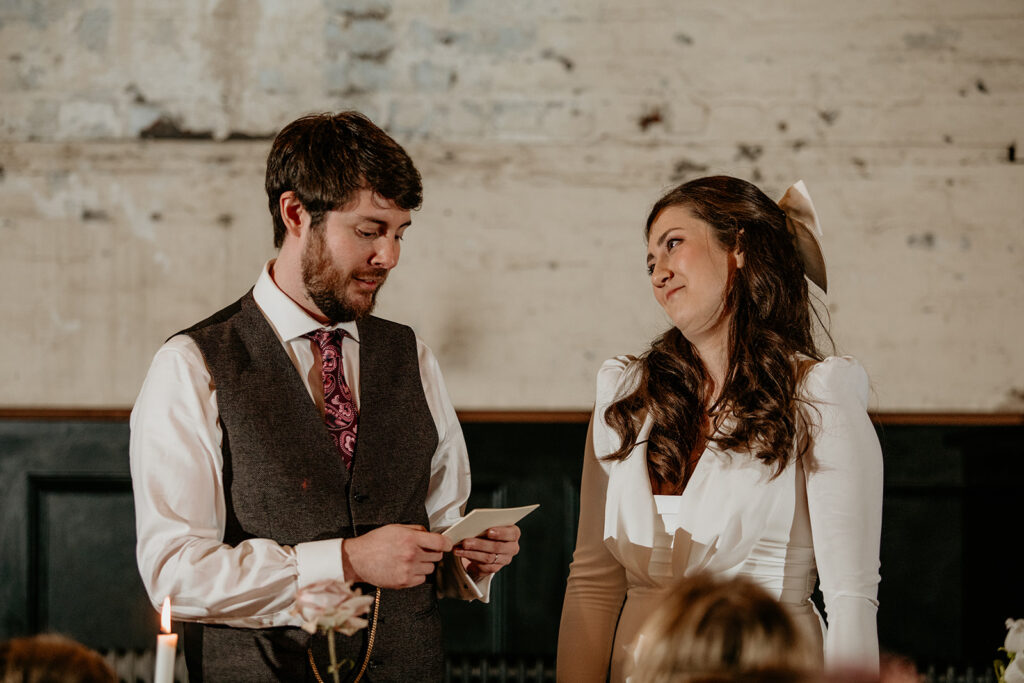 Bride and groom saying their speeches which they planned when putting together a relaxed wedding day timeline