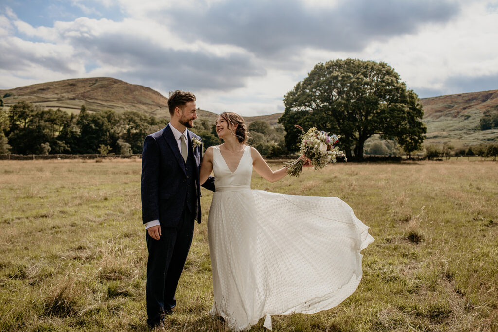 A couple during their wedding in the UK capturing outdoor portraits