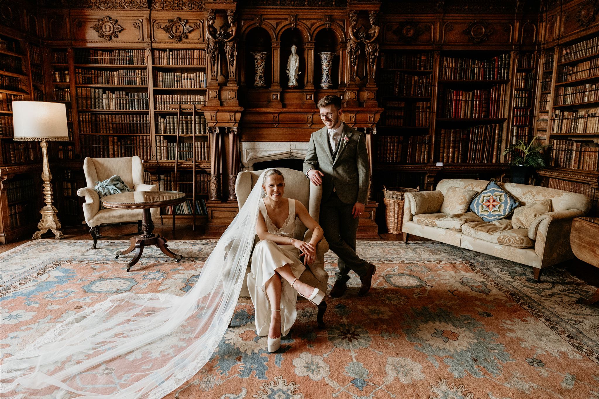 wedding couple in the library of arley hall
