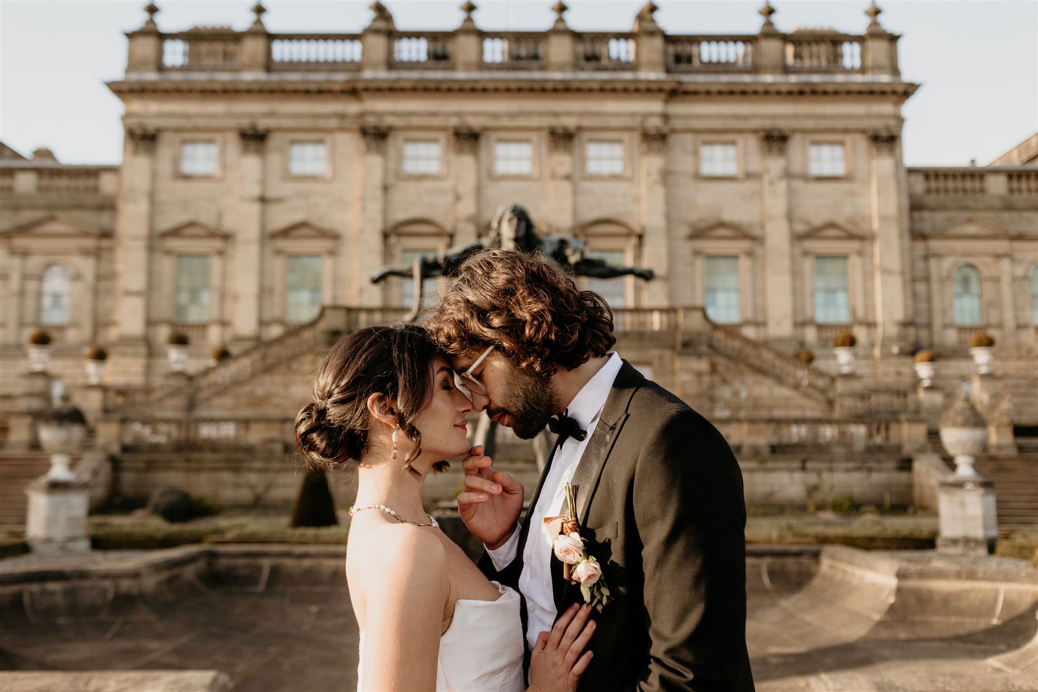 bride and groom on the terrace of harewood house